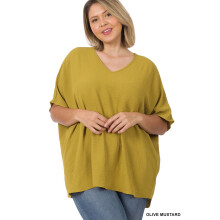 Damebluse med V-hals og vævet dolman-print og lomme