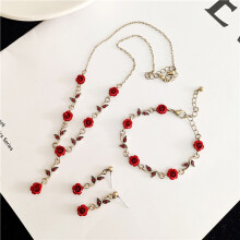 Women's rose necklace set with golden chain, bracelet, and