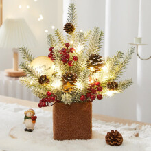 Mini artificial Christmas tree with red berry and pine cone