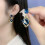 Orecchini con cristalli blu e avvolti in filo placcato oro (1 paio) 7