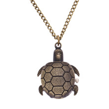Vintage pocket watch with chain and turtle keychain