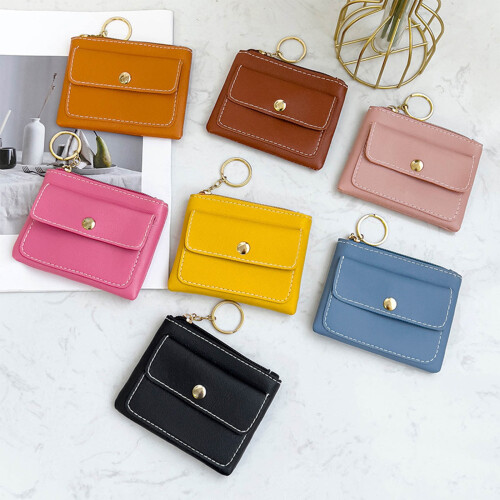 Bolsa feminina preta mini casual com porta-moedas e compartimento para celular.
