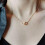 Modieuze dubbele ring hartketting zilverkleurig 4