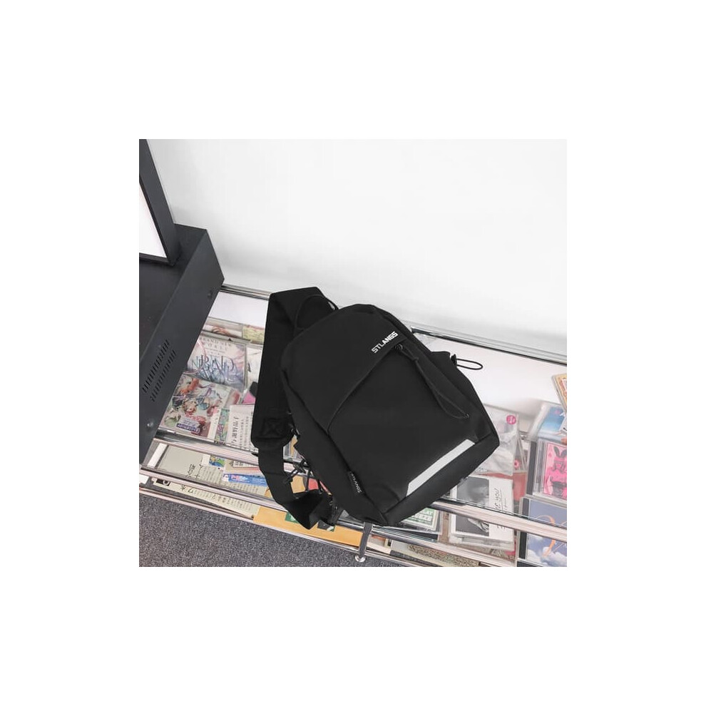 Women's black crossbody chest bag with pendant