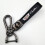 Car-themed leather keychain with silver Cadillac hardware 1