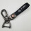Car-themed leather keychain with silver hardware 1