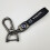 Car-themed leather key ring with silver hardware 1