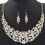 Set da donna composto da collana a bavaglino a spirale con strass e orecchini a gancio. 1