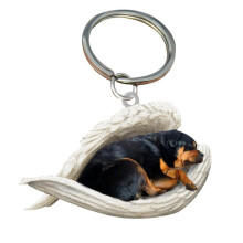 pingente porta-canetas em forma de cachorro Rottweiler dormindo