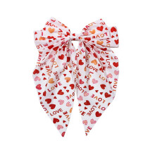 Pinza para el cabello con lazo en forma de corazón y cierre de resorte, 1 unidad.