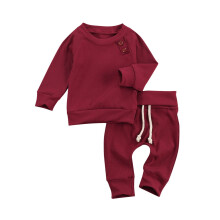 Conjunto de pijama de bebé de 2 piezas: top de punto y pantalón con cordones.