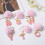 Roze pompon sleutelhanger met hars letter A 3