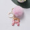 Roze pompon sleutelhanger met hars letter A 8