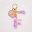 Porte-clés initial pour femme avec pompon violet 1