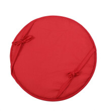 Coussin rond pour chaise d'extérieur, idéal pour les repas en terrasse.