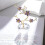 Lilla plommeblomst krystallfigur med gullstilk, 1 stk. 3