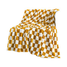 Yellow checkered flannel blanket with black and white