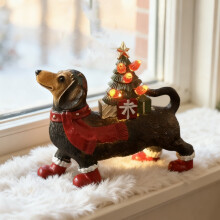 Figurine de Noël en résine représentant un teckel avec une écharpe et