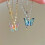 Vlinderketting voor dames met iriserend verloopdesign 1