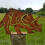 Metalen dinosaurus paaltopper voor hek, E 7