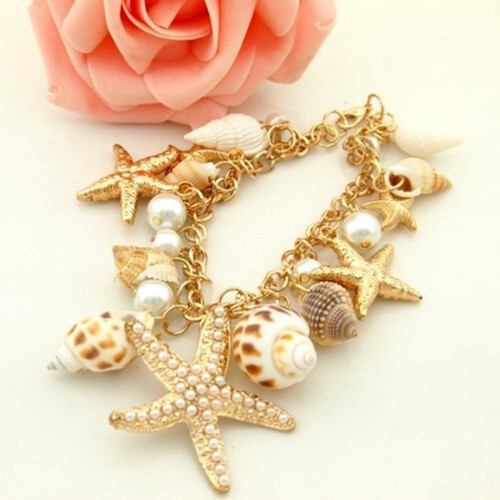 Bracciale da donna con conchiglie, stelle marine e perle finte. 1