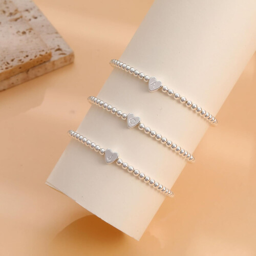 Zartes Damenarmband mit Herzanhänger und elastischen Perlen, 1