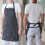 Justerbart pinstripete forkle med 2 lommer, svart 4