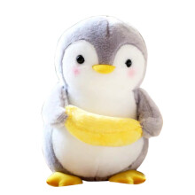 Plysjpingvin som holder banan kosedyr