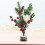 Mini sapin de Noël décoré de baies et de fleurs 1