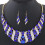Set da donna con collana a bavaglino a spirale e orecchini con strass blu 1