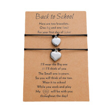 Pulsera de mujer con diseño de corazón y tarjeta, de acero inoxidable trenzado en cera color melocotón.