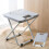 Tabouret de camping gris, pliable, 25 cm, léger, supporte jusqu'à 90 kg. 2