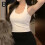 Polyester backless tank top with built-in bra pads, one size 4