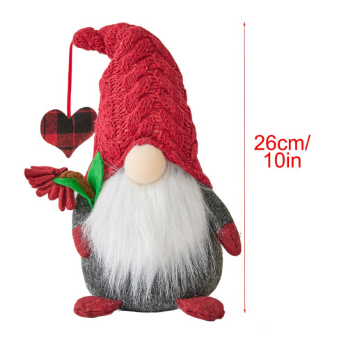 Weihnachtswichtel-Puppe mit Strickmütze und Glücksbringer 2