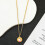 Collier pendentif rond doré Hello Kitty pour femme 3