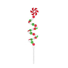 Décoration de Noël en forme de bonbon, rouge, vert et blanc, avec des spirales bouclées et des pics. Sapin de Noël.
