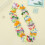 Conjunto de tiara havaiana com flores e folhas verdes. 4
