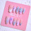 Frely's almond-shaped purple cherry blossom press-on nails 1