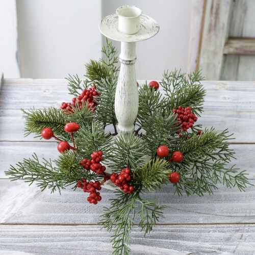 Christmas wreath candle ring with red berries and pinecones