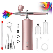 Airbrushset met luchtcompressor voor het schilderen van make-up en nagels.