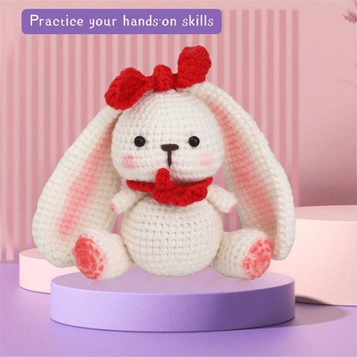DIY crochet kit with yarn, needles, and plush doll 1