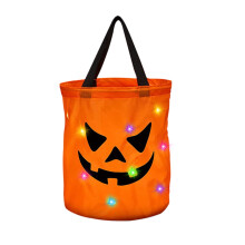 Pumpkin-shaped plush throw pillow for fall and Halloween