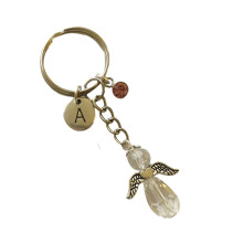 Gezegende Schittering: Religieuze feestbedankjes met kristallen accessoires, elegante zilveren metalen gelukshanger, perfecte beschermengel cadeaus