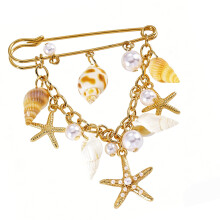 Mooie legeringsbroche met strandthema met schelp en zeester,