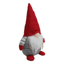 Rote Plüsch-Gnompuppe zur Dekoration, gesichtslose Puppe im Cartoon-Stil, Fotorequisite