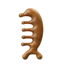 Peigne en bois de santal vert fait main pour le massage de la tête, orné d'un motif dauphin.