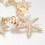 Pulseira com pingente de concha, estrela-do-mar cravejada de strass e pérolas de vidro. 2