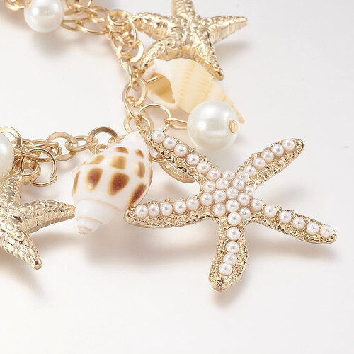Pulseira com pingente de concha, estrela-do-mar cravejada de strass e pérolas de vidro. 1