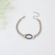 Pulseira oval de aço inoxidável e titânio com zircônia.