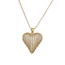 Damesketting in de vorm van een hol hart van goudkleurig roestvrij staal met zirkonia.